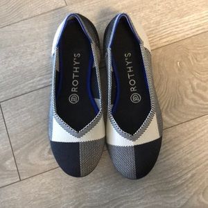 Rothy’s Black and White Captoe flats, size 7.